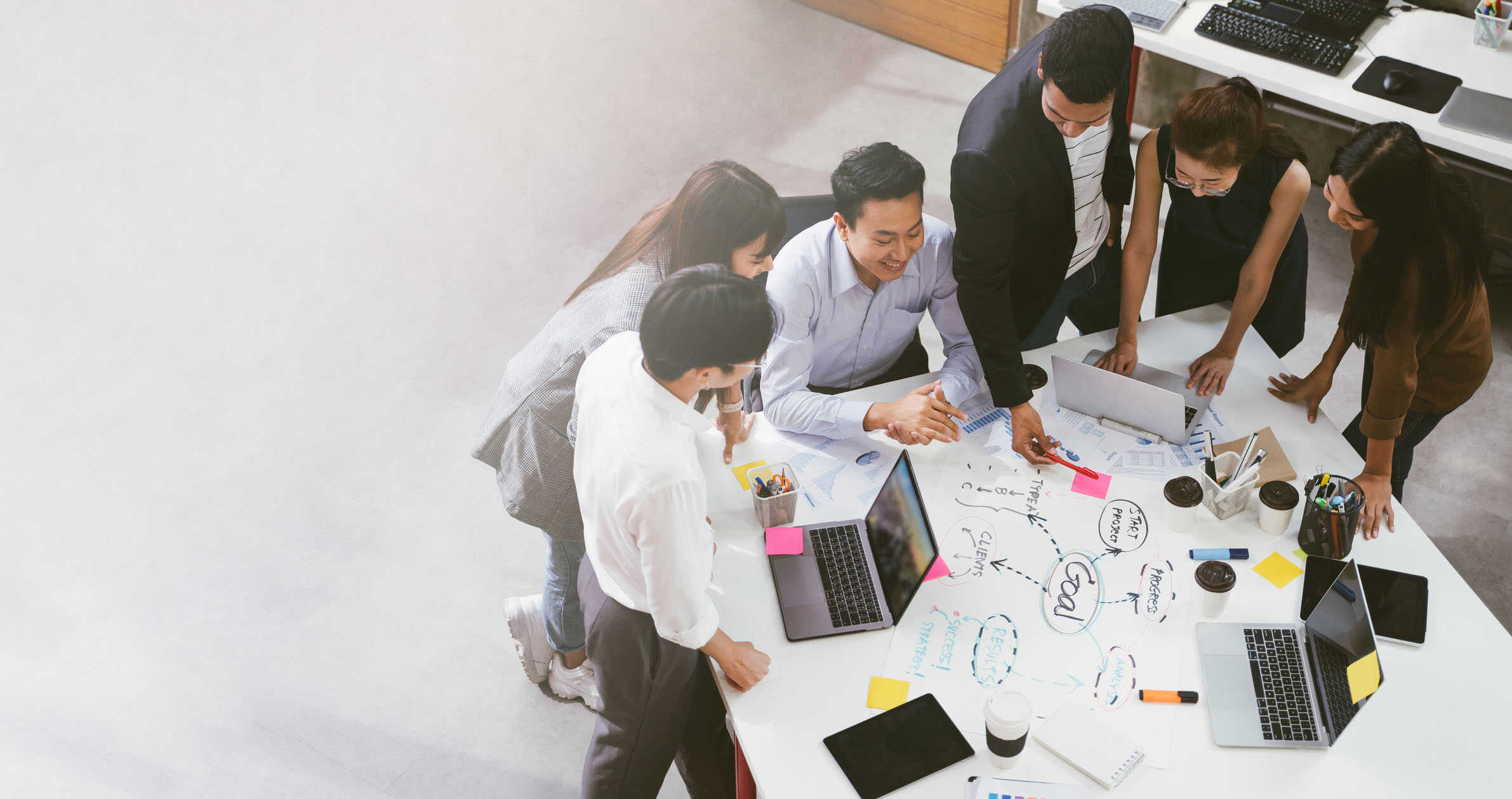 Group of Asian business people team meeting in modern office working design planning and ideas concept